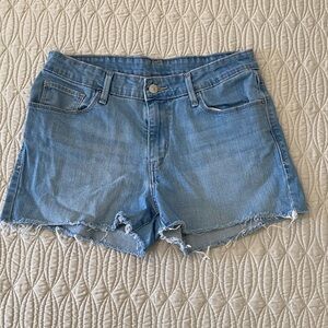 Levi’s light wash denim shirts with frayed hem Size 30